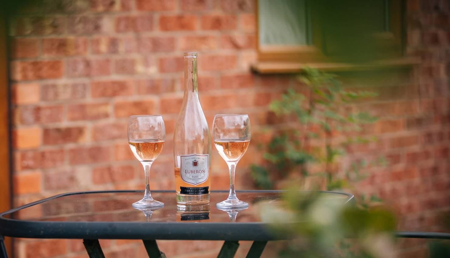 Welcome to Millmoor Farm Holidays Wine glasses outside Carter's Lodge